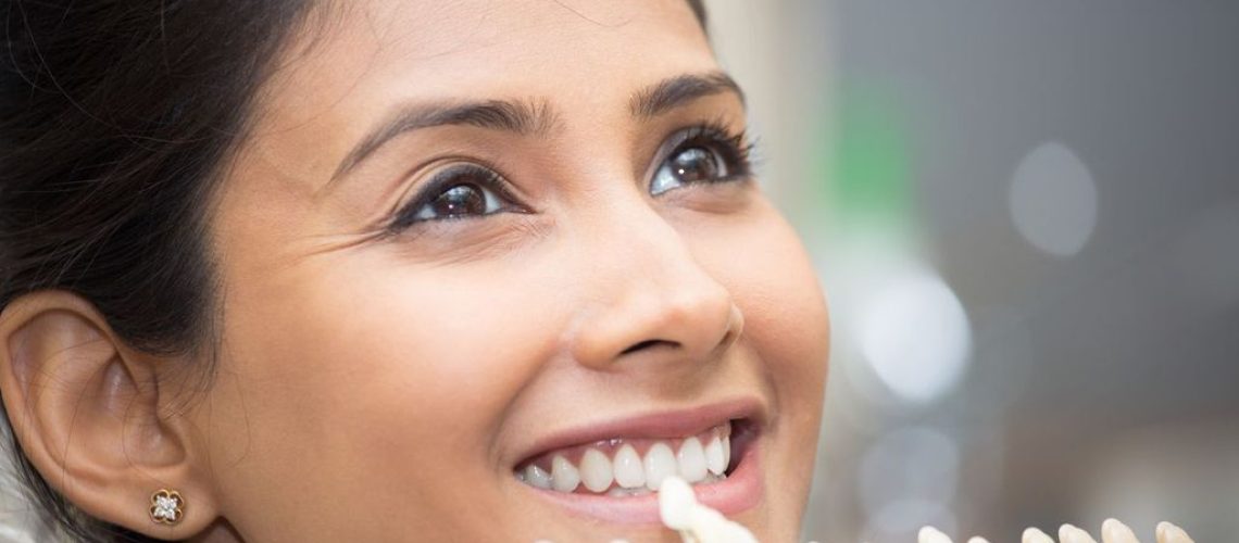 What is the Difference Between Dental Implants & Veneers